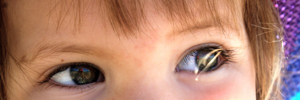 Sunshine & beach reflections in curious eyes