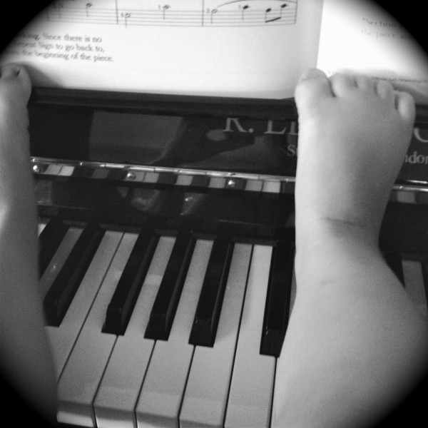 Alice's toes at two on the piano!