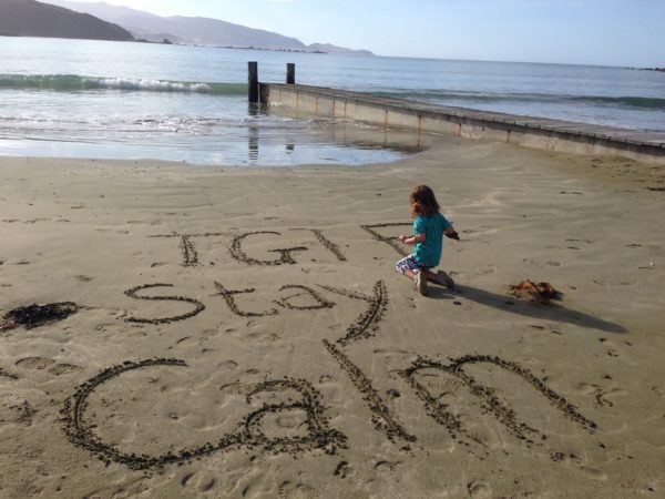 Thank goodness it's Friday drawing in the sand at Lyall Bay Beach