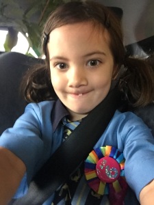 Alice & her very wiggly tooth 'selfie' on the way to school on the morning of her 6th Birthday!